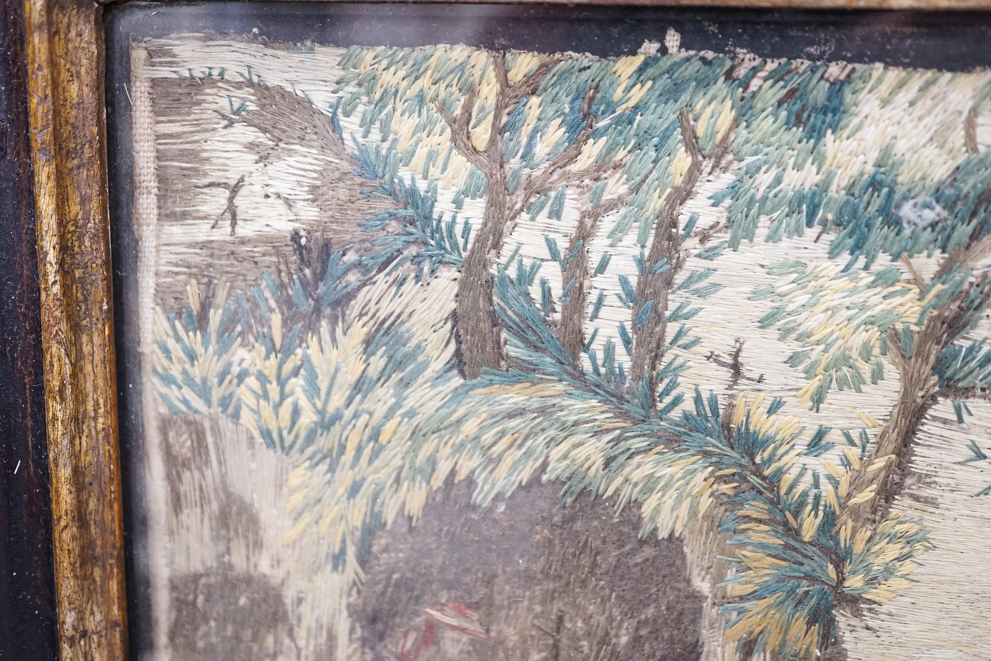 A pair of 18th century wool and silkwork pictures in ebonised frames, 26 cms high x 22 cms wide.